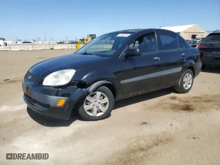 2009 Kia Rio SX with VIN KNADE223396450416, listed as a Copart auction lot 52295225 with 129,858 mi miles and Salvage Title. Bid and sale history available at carsss.com. Image 1.