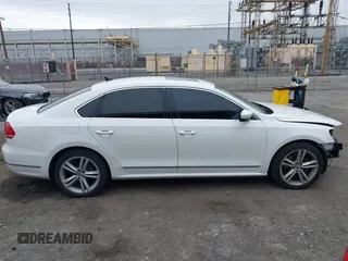 2015 Volkswagen Passat 1.8T SE w/Sunroof & Nav with VIN 1VWBT7A31FC043798, listed as a IAAI auction lot 42108289 with 132,442 mi miles. Bid and sale history available at carsss.com. Image 14.