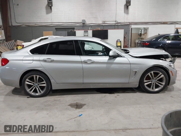 2016 BMW 4 Series 428i xDrive with VIN WBA4C9C5XGG138843, listed as a IAAI auction lot 41747358 with 63,804 mi miles and . Bid and sale history available at DreamBid. Image 13.