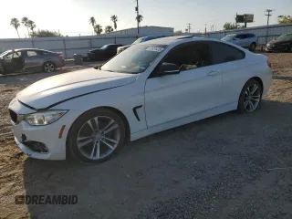 2015 BMW 4 Series 428i with VIN WBA3N3C59FK233053, listed as a Copart auction lot 52651415 with 165,218 mi miles and Salvage Title. Bid and sale history available at carsss.com. Image 1.