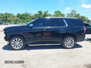 2021 Chevrolet Tahoe Premier with VIN 1GNSKSKDXMR195984, listed as a IAAI auction lot 42528305 with 89,925 mi miles and . Bid and sale history available at DreamBid. Image 15.