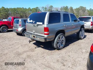 2001 GMC Yukon SLT with VIN 1GKEK13V11R220343, listed as a IAAI auction lot 41703786 with 213,518 mi miles. Bid and sale history available at carsss.com. Image 4.
