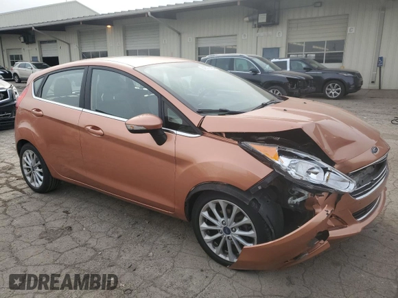 2017 Ford Fiesta Titanium with VIN 3FADP4FJ8HM164132, listed as a Copart auction lot 82577424 with 63,686 mi miles and Salvage Title. Bid and sale history available at DreamBid. Image 4.