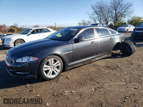 2015 Jaguar XJ Portfolio with VIN SAJWJ2GD1F8V77420, listed as a Copart auction lot 81786334 with 129,190 mi miles and Salvage title. Bid and sale history available at DreamBid. Image 1.