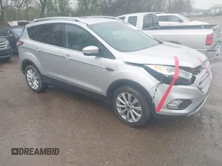 2017 Ford Escape Titanium with VIN 1FMCU0J96HUC21987, listed as a IAAI auction lot 41971376 with 97,488 mi miles and . Bid and sale history available at DreamBid. Image 1.