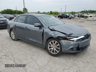 2014 Volkswagen Jetta SE with VIN 3VWD07AJ7EM363186, listed as a Copart auction lot 60873465 with 215,323 mi miles and Salvage title. Bid and sale history available at DreamBid. Image 4.