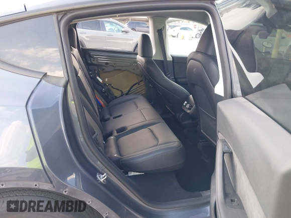 2023 Tesla Model Y Long Range with VIN 7SAYGDEEXPA078629, listed as a IAAI auction lot 42046354 with 27,245 mi miles and . Bid and sale history available at DreamBid. Image 8.