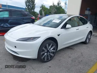 2024 Tesla Model 3 with VIN 5YJ3E1EA6RF751009, listed as a IAAI auction lot 40537919 with Not Provided miles and . Bid and sale history available at DreamBid. Image 2.