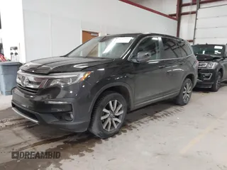 2019 Honda Pilot EX-L with VIN 5FNYF6H5XKB067858, listed as a IAAI auction lot 41643807 with 102,114 mi miles and . Bid and sale history available at carsss.com. Image 2.