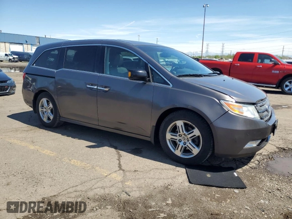 2012 Honda Odyssey Touring with VIN 5FNRL5H90CB093963, listed as a Copart auction lot 55434725 with 202,867 mi miles and Salvage Title. Bid and sale history available at DreamBid. Image 4.