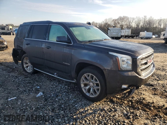 2015 GMC Yukon SLT with VIN 1GKS1BKC0FR735059, listed as a Copart auction lot 42960685 with 242,220 mi miles and Salvage Title. Bid and sale history available at carsss.com. Image 4.