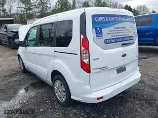 2015 Ford Transit Connect Wagon XLT with VIN NM0AE8F7XF1219105, listed as a IAAI auction lot 41237462 with 135,209 mi miles. Bid and sale history available at carsss.com. Image 3.