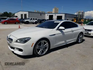 2012 BMW 6 Series 650i with VIN WBALX3C59CC528427, listed as a Copart auction lot 71097654 with 96,036 mi miles and Salvage Title. Bid and sale history available at carsss.com. Image 1.