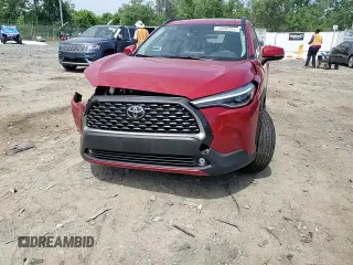2022 Toyota Corolla Cross XLE with VIN 7MUDAABG5NV005882, listed as a Copart auction lot 56690265 with 6,427 mi miles and Salvage title. Bid and sale history available at DreamBid. Image 14.