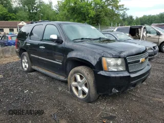2010 Chevrolet Tahoe LTZ with VIN 1GNUKCE05AR164175, listed as a Copart auction lot 57223295 with 423,010 mi miles and Salvage title. Bid and sale history available at DreamBid. Image 4.