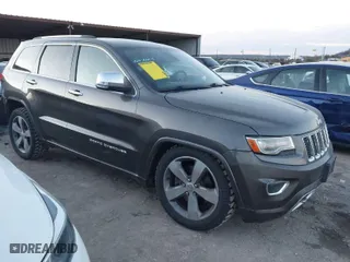 2014 Jeep Grand Cherokee Overland with VIN 1C4RJFCT8EC380899, listed as a IAAI auction lot 41372034 with 140,413 mi miles. Bid and sale history available at carsss.com. Image 1.