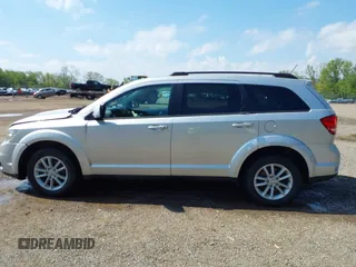 2013 Dodge Journey SXT z VIN 3C4PDCBG4DT564290, wystawiony jako IAAI lot #42225485 z przebiegiem 69 029 mil mil oraz . Historia ofert i sprzedaży dostępna na DreamBid. Obrazek 14.