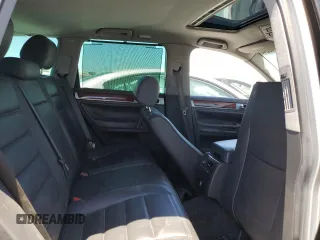 2004 Volkswagen Touareg z VIN WVGCM77L74D059969, wystawiony jako Copart lot #68238193 z przebiegiem Nie podano mil oraz Szkody całkowita. Historia ofert i sprzedaży dostępna na DreamBid. Obrazek 11.