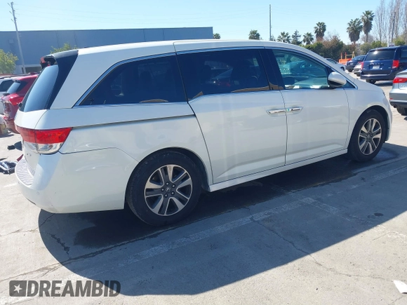 2015 Honda Odyssey Touring Elite with VIN 5FNRL5H91FB038099, listed as a IAAI auction lot 41829649 with 167,017 mi miles and . Bid and sale history available at DreamBid. Image 4.
