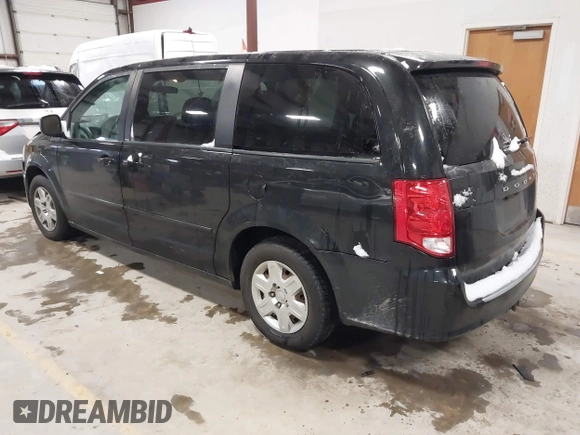 2012 Dodge Grand Caravan SE with VIN 2C4RDGBG8CR155758, listed as a IAAI auction lot 41300951 with 126,209 mi miles and . Bid and sale history available at DreamBid. Image 3.