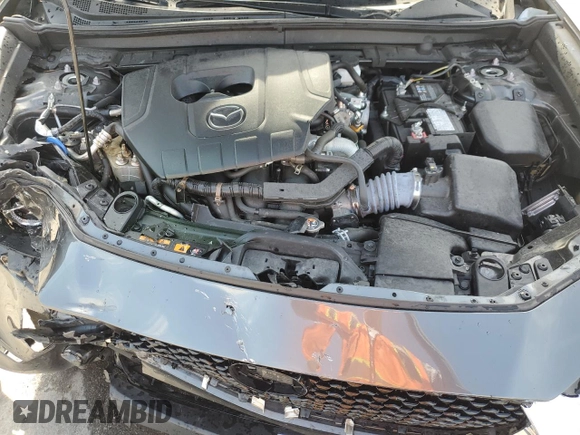 2023 Mazda CX-30 S Premium z VIN 3MVDMBDM9PM558451, wystawiony jako Copart lot #53997465 z przebiegiem 27 633 mil mil oraz Nie do naprawy • Non repairable. Historia ofert i sprzedaży dostępna na DreamBid. Obrazek 12.