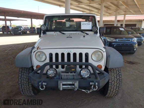 2007 Jeep Wrangler X with VIN 1J4FA24137L128418, listed as a IAAI auction lot 42317921 with 148,412 mi miles and . Bid and sale history available at DreamBid. Image 12.
