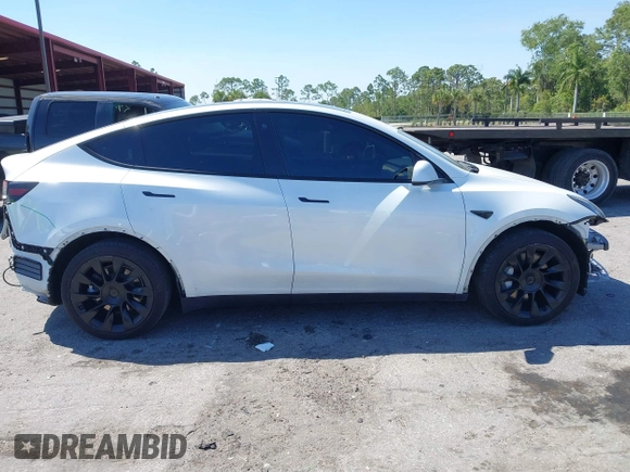 2022 Tesla Model Y Long Range with VIN 7SAYGAEE8NF431786, listed as a IAAI auction lot 41750353 with 67,846 mi miles and . Bid and sale history available at carsss.com. Image 14.