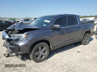 2023 Honda Ridgeline RTL z VIN 5FPYK3F54PB043289, wystawiony jako Copart lot #52312015 z przebiegiem 34 219 mil mil oraz Szkoda całkowita • Salvage title. Historia ofert i sprzedaży dostępna na DreamBid. Obrazek 1.