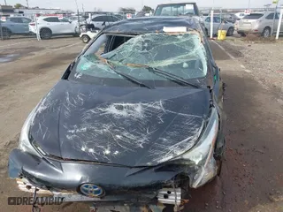 2018 Toyota Prius Two with VIN JTDKARFU7J3062094, listed as a IAAI auction lot 41648271 with 116,260 mi miles. Bid and sale history available at carsss.com. Image 6.