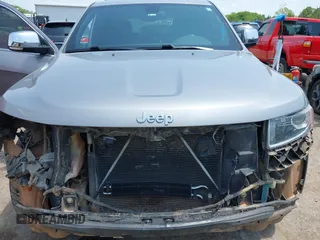 2014 Jeep Grand Cherokee Limited with VIN 1C4RJFBG4EC589321, listed as a IAAI auction lot 42335043 with 153,428 mi miles and . Bid and sale history available at DreamBid. Image 6.