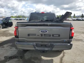 2023 Ford F-150 Lightning Pro with VIN 1FT6W1EV0PWG34788, listed as a Copart auction lot 54454805 with 11,432 mi miles and Salvage title. Bid and sale history available at DreamBid. Image 6.