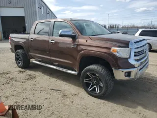 2015 Toyota Tundra 4WD Truck Platinum with VIN 5TFAY5F14FX438207, listed as a Copart auction lot 52706155 with 156,683 mi miles and Clean Title. Bid and sale history available at carsss.com. Image 4.
