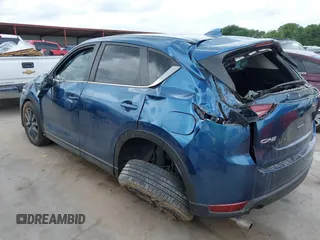 2018 Mazda CX-5 Touring z VIN JM3KFACM5J1442416, wystawiony jako IAAI lot #42093137 z przebiegiem 65 102 mil mil oraz . Historia ofert i sprzedaży dostępna na DreamBid. Obrazek 3.