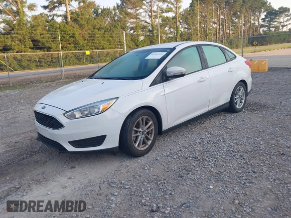 2016 Ford Focus SE z VIN 1FADP3F22GL355984, wystawiony jako IAAI lot #42564516 z przebiegiem 128 002 mil mil oraz . Historia ofert i sprzedaży dostępna na DreamBid. Obrazek 2.
