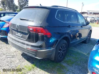 2021 Volkswagen Tiguan SE with VIN 3VV3B7AX0MM129887, listed as a IAAI auction lot 40565638 with 84,790 mi miles. Bid and sale history available at carsss.com. Image 4.