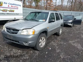 2001 Mazda Tribute LX with VIN 4F2YU08151KM06561, listed as a IAAI auction lot 41478779 with 54,826 mi miles and . Bid and sale history available at DreamBid. Image 2.