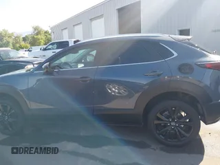 2022 Mazda CX-30 S Carbon Edition with VIN 3MVDMBCL6NM431985, listed as a IAAI auction lot 42610558 with Not provided miles and . Bid and sale history available at DreamBid. Image 13.