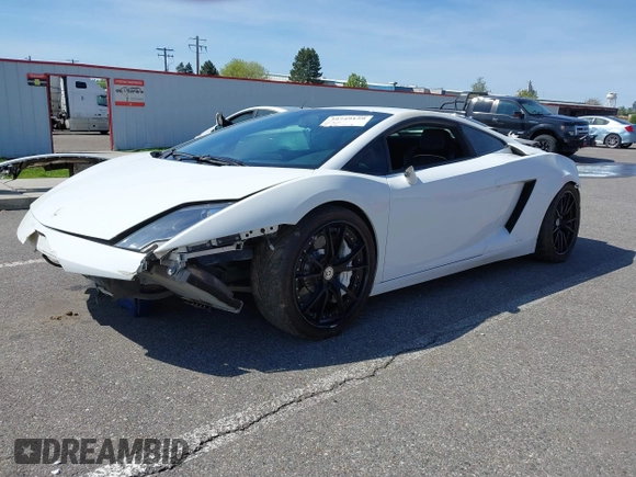 2009 Lamborghini Gallardo z VIN ZHWGU54T59LA07777, wystawiony jako IAAI lot #39749159 z przebiegiem 8730 mil mil oraz . Historia ofert i sprzedaży dostępna na DreamBid. Obrazek 23.