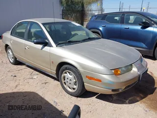 2002 Saturn SL z VIN 1G8ZK52762Z300207, wystawiony jako IAAI lot #42110893 z przebiegiem 142 441 mil mil oraz . Historia ofert i sprzedaży dostępna na DreamBid. Obrazek 1.