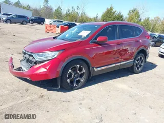 2019 Honda CR-V Touring with VIN 2HKRW1H9XKH500025, listed as a IAAI auction lot 41667564 with 73,889 mi miles. Bid and sale history available at carsss.com. Image 2.