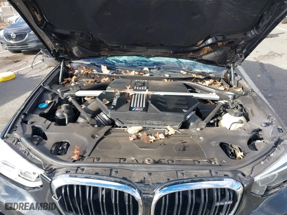 2020 BMW X4 M Competition with VIN 5YMUJ0C08LLA99688, listed as a IAAI auction lot 41226234 with 63,497 mi miles. Bid and sale history available at carsss.com. Image 10.