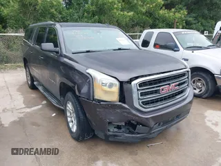 2015 GMC Yukon XL SLT z VIN 1GKS1HKC9FR250390, wystawiony jako IAAI lot #42445216 z przebiegiem 243 193 mil mil oraz . Historia ofert i sprzedaży dostępna na DreamBid. Obrazek 1.