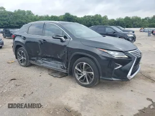 2017 Lexus RX 350 with VIN 2T2BZMCA9HC129460, listed as a Copart auction lot 57301995 with 163,128 mi miles and Salvage title. Bid and sale history available at DreamBid. Image 4.