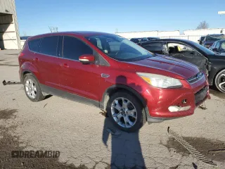 2013 Ford Escape SEL with VIN 1FMCU9H9XDUA48561, listed as a Copart auction lot 47809485 with 310,598 mi miles and Salvage Title. Bid and sale history available at DreamBid. Image 4.