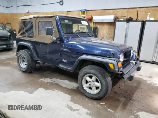 2000 Jeep Wrangler SE with VIN 1J4FA29P1YP739555, listed as a Copart auction lot 58501025 with 128,458 mi miles and Clean title. Bid and sale history available at DreamBid. Image 4.