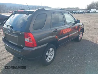 2009 Kia Sportage LX with VIN KNDJE723097623239, listed as a IAAI auction lot 41233933 with 169,444 mi miles. Bid and sale history available at carsss.com. Image 4.