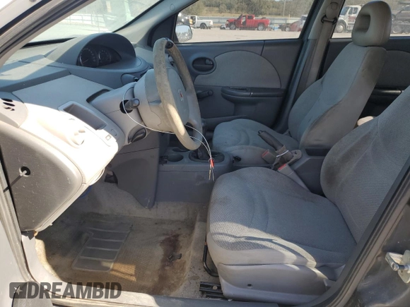 2003 Saturn ION ION 1 z VIN 1G8AF52F83Z151812, wystawiony jako Copart lot #77000594 z przebiegiem 313 620 mil mil oraz Szkoda całkowita • Salvage title. Historia ofert i sprzedaży dostępna na DreamBid. Obrazek 7.