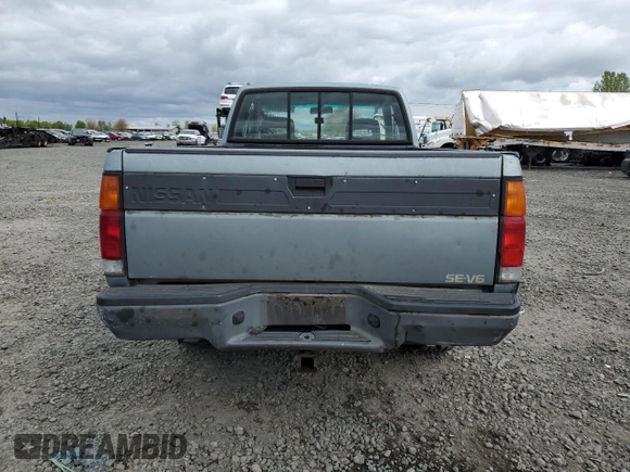 1993 Nissan Frontier SE z VIN 1N6HD16Y0PC408188, wystawiony jako Copart lot #71028394 z przebiegiem 258 939 mil mil oraz Szkoda całkowita • Salvage title. Historia ofert i sprzedaży dostępna na DreamBid. Obrazek 6.