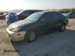 2004 Ford Focus SE with VIN 1FAFP34Z44W117010, listed as a Copart auction lot 64989875 with 207,206 mi miles and Salvage title. Bid and sale history available at DreamBid. Image 1.