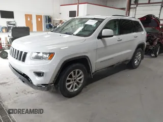2014 Jeep Grand Cherokee Laredo with VIN 1C4RJFAG4EC309401, listed as a IAAI auction lot 41996233 with 243,541 mi miles and . Bid and sale history available at DreamBid. Image 2.